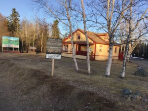 The Roberts Arm Heritage House at the entrance to the Crescent Lake RV Park, with the Jack's Place sign. (Photos by Fred Parsons) 